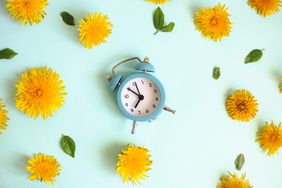 Study: Waking Up an Hour Earlier Help Prevent Depression: alarm clock and flowers