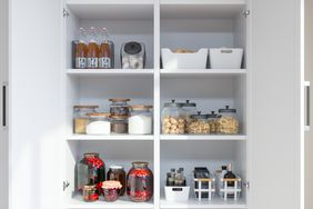 Kitchen cabinet with organized decanted food