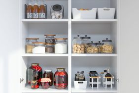 Organised Pantry Items With Variety of Nonperishable Food Staples And Preserved Foods in Jars On Kitchen Shelf.