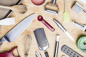 View from above kitchen utensils on wooden surface - knolling